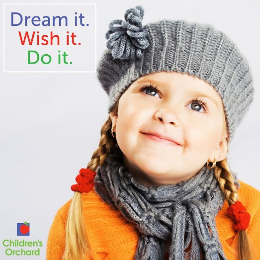 Children's Orchard graphic with photo of little girl wearing grey knitted hat and scarf with pigtail braids and text that says dream it, wish it, do it